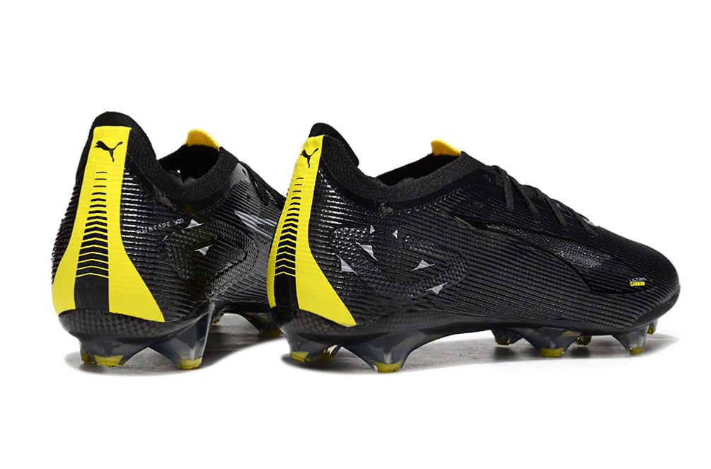 Chuteira Puma Ultra 5 Carbon FG - Preto/Amarelo